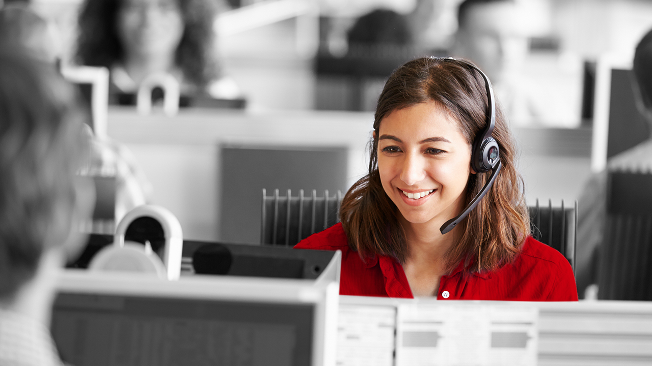 Woman speaking into headset; image used for HSBC Australia FAQ and support page.